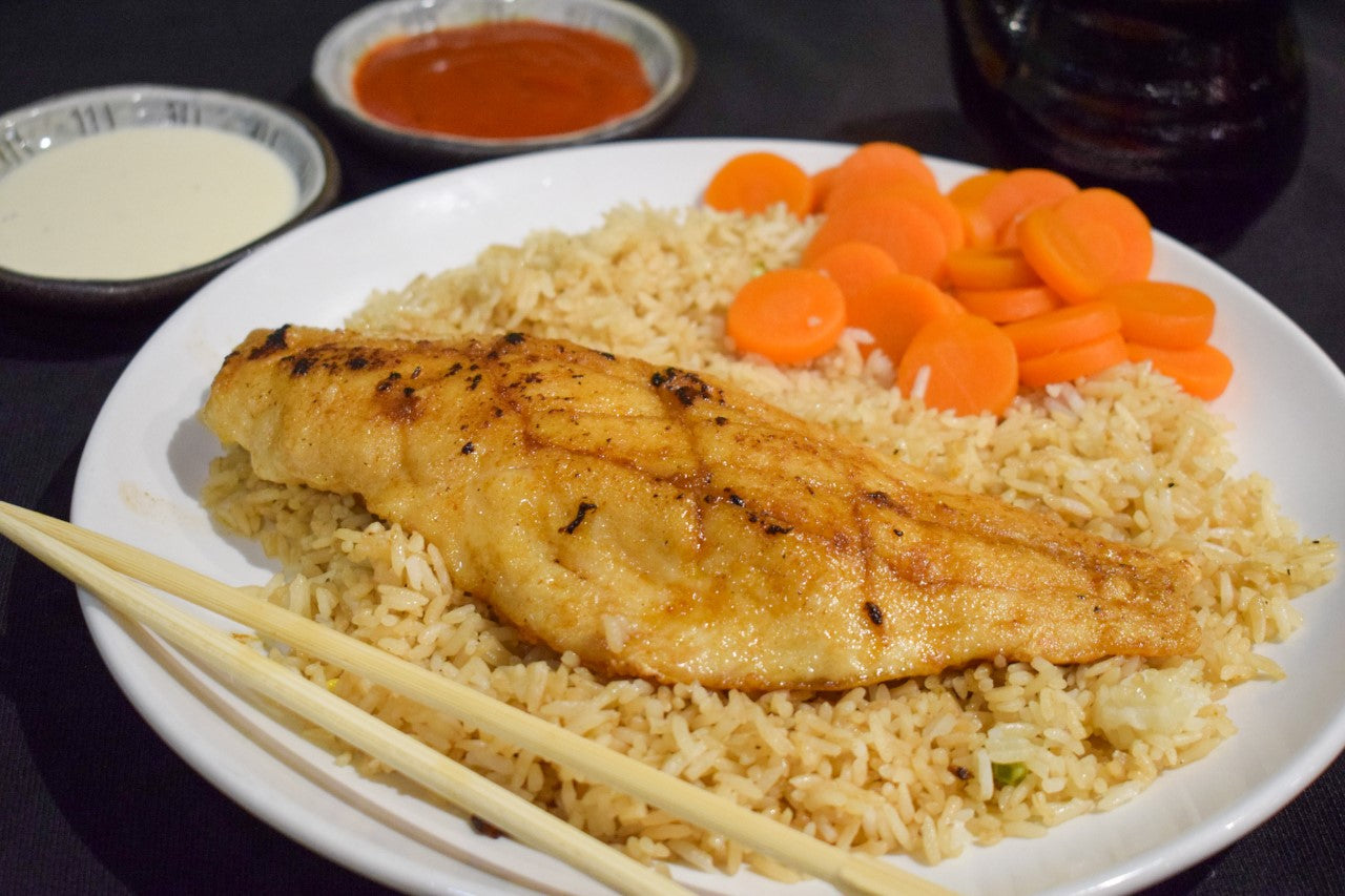 hibachi red snapper with rice, carrots, and yum yum sauce